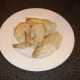 Chicken is cut in to portions for easier deboning