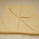 Unroll a roll of crescent rolls onto a piece of wax paper.