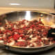 On medium heat, brown meat, onions, and garlic.