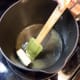 Melt 1/4 cup butter on stove. Or melt in microwave for 20 seconds.