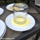 Step 6: Pour SMALL AMOUNTS of each color of paint, including the base color, onto individual disposable plates. Dip different sizes of jar tops and lids into the paint, taking care not to overload the tops and lids with too much paint. An over-abun