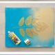 Step 4: Spray the canvas and leaf with a coat of metallic spray paint, including the edges, then carefully remove leaf. Allow the painted canvas to dry completely. Install a sawtooth hanger to the back of the canvas and hang your new masterpiece!