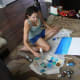Artist with ombre chipboard letter art - a work in progress