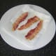 Draining bacon in kitchen paper