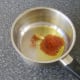 Chilli powder and garlic added to oilve oil