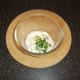 A simple dip of soured cream, garlic and chives is prepared