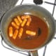 Cocktail sausages are briefly simmered in the hoisin and garlic sauce