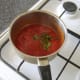 Tomatoes and basil are added to the spices