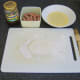 Preparing to assemble cocktail sausage and pickle mini pasties