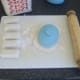 A template is used to cut ovals for making mini pasties
