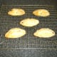 Pasties are rested and cooled on a wire rack
