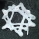 String the trinket with white or silver thread to hang on the tree.