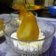 Place the cooked pear on top of the yogurt.