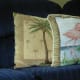 A throw pillow depicts flamingos.