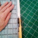 Removing the selvages.