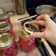 Step Six: Wipe the rims of your jars with a wet washcloth and add lids and rings.