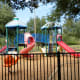 Gated Tot Lot play area in Ray Miller Park