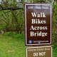 This sign signaled that we were entering another park after crossing a bridge over the creek.