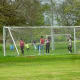 Soccer fields had a few people playing in them.