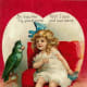 Cute kids: little girl with parrot Valentine's Day card