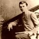 The outlaw Robert Ford, who lived from 1860 to 1892, in an undated photograph by an unknown author reportedly posing with the weapon he used to assassinate Jesse James.