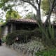The driveway is a good example of how the curbs were built along the street. The block long neighborhood had to petition for special status to retain the original curbs. Traveling along Mills is a modern wide street, but as you come up to the village