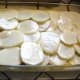 Now take the egg/yogurt/milk mixture and pour it evenly over the top of the musaka. If you did the layering right, it should not come all the way up to the top of the pan.