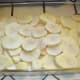 Make your first potato layer about 2-3 potato slices thick so that about a fourth to a third of the depth of the pan is filled. You want the surface to be fairly even. This took me about two and a half potatoes. Sprinkle the layer with salt to taste.