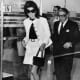 Jackie and Onasis - Jackie is not wearing gloves and carrying one of her signature hand bags