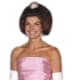 Jackie Kennedy wearing gloves in a pink evening gown