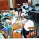 Workers at the women's cooperative create individual works, but share supplies, profits, and camaraderie.