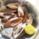 Squeeze the lemon juice over the fish pieces.