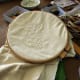 Using a quilting hoop helps keep your stitches even.