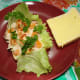 With tuna flakes mixture, tomato slices and parsley on top.