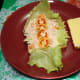 With tuna flakes mixture and tomato slices on top.