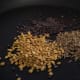 Clockwise from bottom left: Fenugreek seeds, Mustard seeds, Cumin seeds