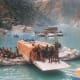 The apple boxe, trucks and passengers being ferried on river rafts in 1998 during cloud brust at Wangtoo in Kinnaur