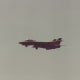 An F-14 with its landing gear down.