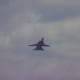 An F-14 with its wings extended during a flight demonstration at Andrews AFB, MD.
