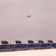 An F-14 in flight with F/A-18s of the Blue Angels on the tarmac at Andrews AFB, MD.