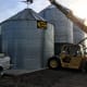 What you use to lift your bin may depend on what is available on your worksite. On this job, we had access to a large forklift and skilled operator, provided by the bin owner.