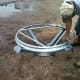 Long bolts are inserted in the lower peak ring, to center it on the lifting ring and keep it in place. It needs to be kept dead center.