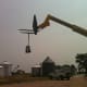 The lifting ring hangs out of the way while the rest of the job site is set up for the day's building.