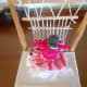 A view from behind the woman weaving.
