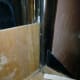 Placing scrap plywood in cut out area and marking it to cut strip to fit