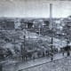 View of the Grover Shoe factory boiler explosion disaster from Church & Alden Shoe Factory, Brockton, Massachusetts. March 20, 1905. Smokestack and ruins at right, Dahlborg Block at left, ruined dwellings in background.