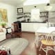 A family of five live happily in 665 square feet, which features one main floor bedroom, one bathroom and a loft for the children.