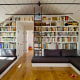 The ladder accesses a small loft with bed where the couple sleep.