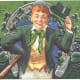 St Patricks Day cards: Irish lad in green coat with green top hat in front of shamrock design "Erin Go Bragh"