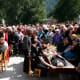 People grieving at the funeral for victims of accident at the Sayano-Shushenskaya power station. (REUTERS/Ilya Naymushin)